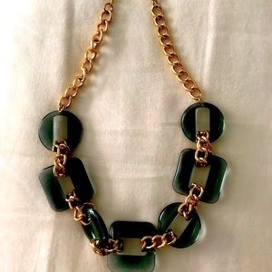 Clear acrylic green and gold “a new day” necklace
